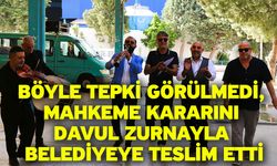 Böyle tepki görülmedi, mahkeme kararını davul zurnayla belediyeye teslim etti