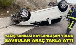 Yağış sonrası kayganlaşan yolda savrulan araç takla attı