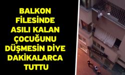 Balkon filesinde asılı kalan çocuğunu düşmesin diye dakikalarca tuttu