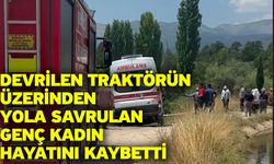 Devrilen traktörün üzerinden yola savrulan genç kadın hayatını kaybetti