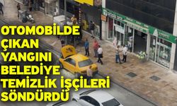 Otomobilde çıkan yangını belediye temizlik işçileri söndürdü