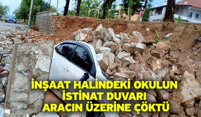 İnşaat halindeki okulun istinat duvarı aracın üzerine çöktü