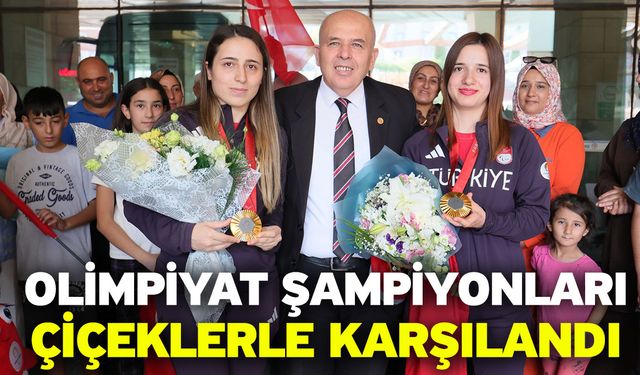 Olimpiyat şampiyonları çiçeklerle karşılandı